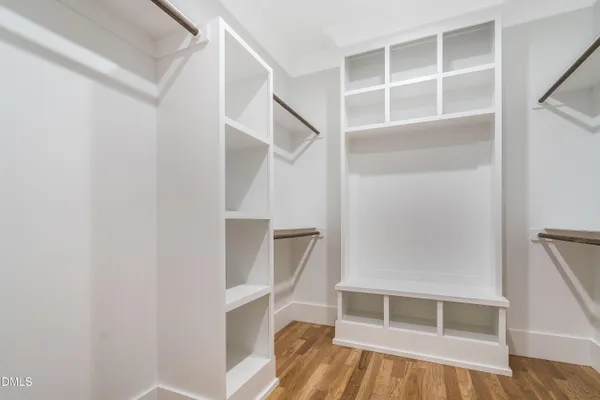 a view of an empty room with window and fireplace