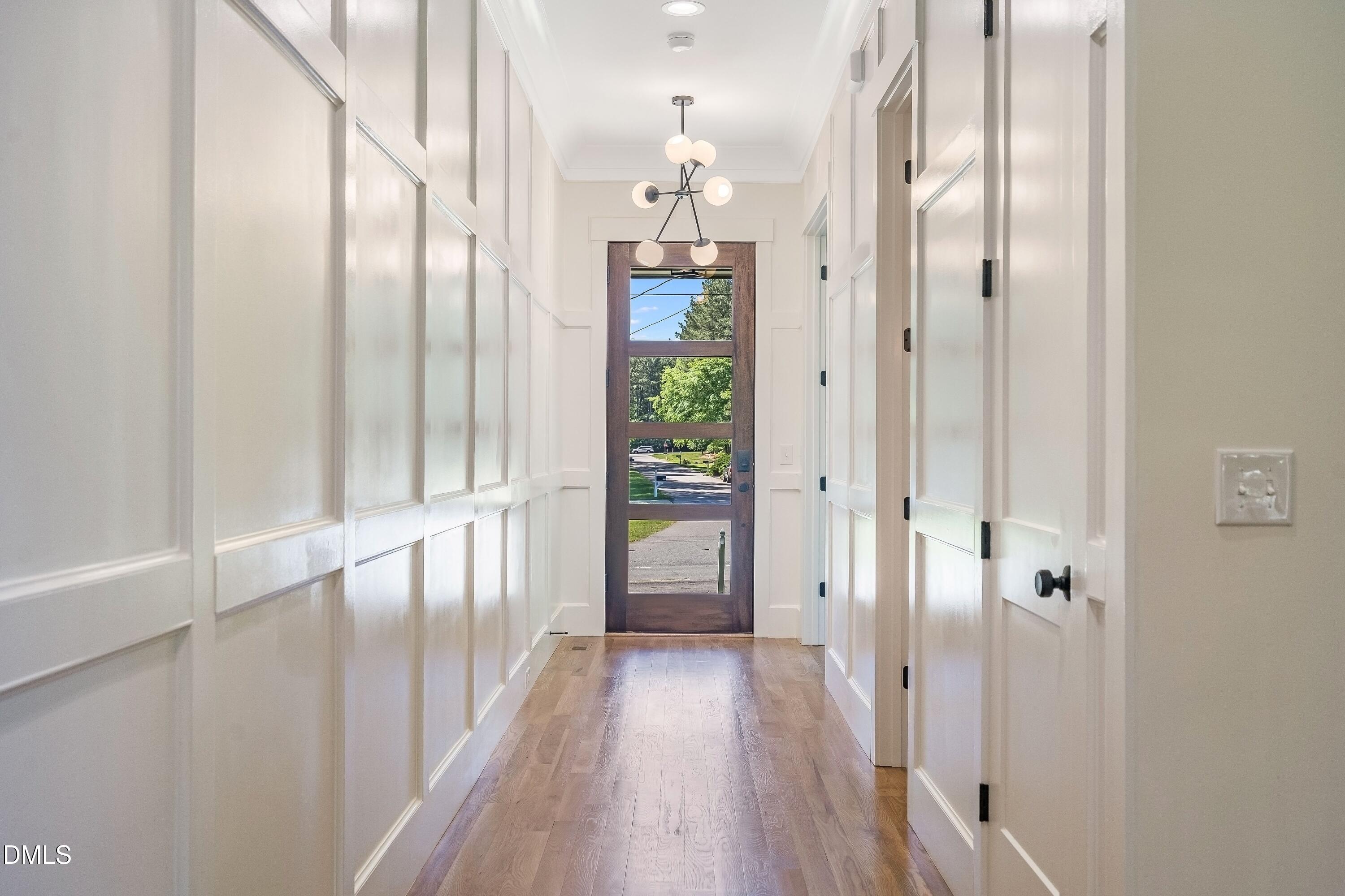 14020 Durant Road Raleigh, NC 27614 - Photo 33 of 86 a view of a hallway with wooden floor and staircase