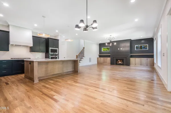 a bathroom with a granite countertop sink a toilet and a mirror