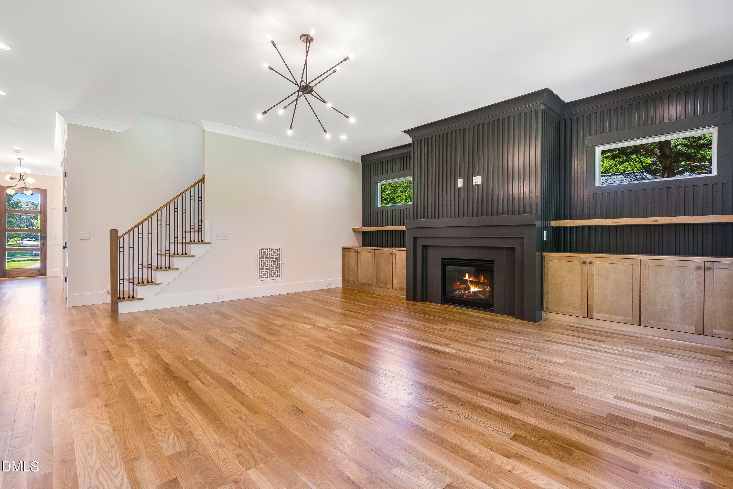 14020 Durant Road Raleigh, NC 27614 - Photo 42 of 86 a view of an empty room with wooden floor fireplace and a window