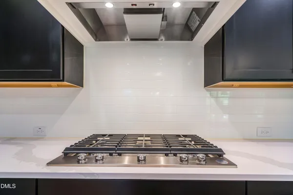 a kitchen with a refrigerator and a sink
