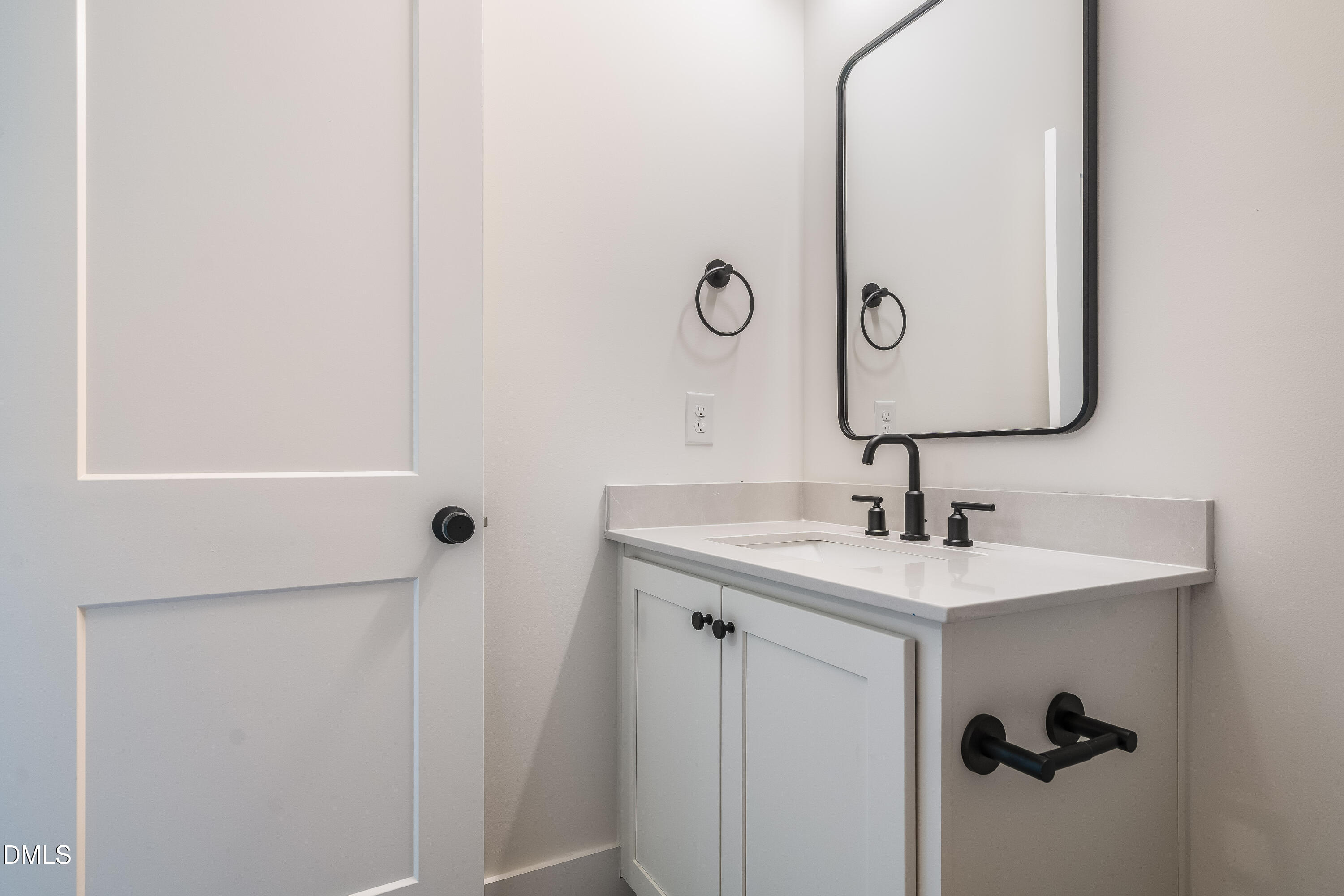 14020 Durant Road Raleigh, NC 27614 - Photo 48 of 86 a bathroom with a sink and a mirror