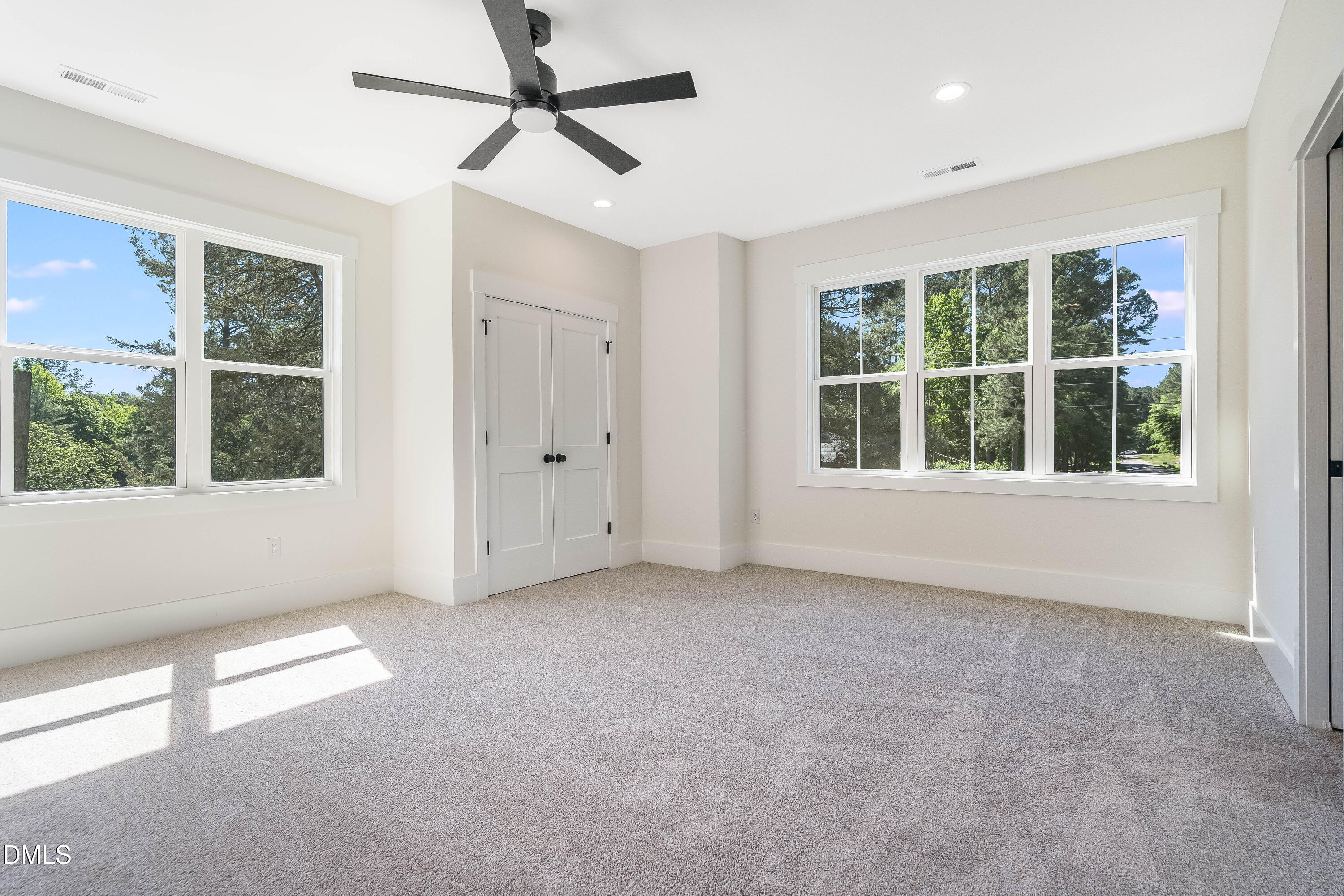 14020 Durant Road Raleigh, NC 27614 - Photo 60 of 86 an empty room with a window and a ceiling fan