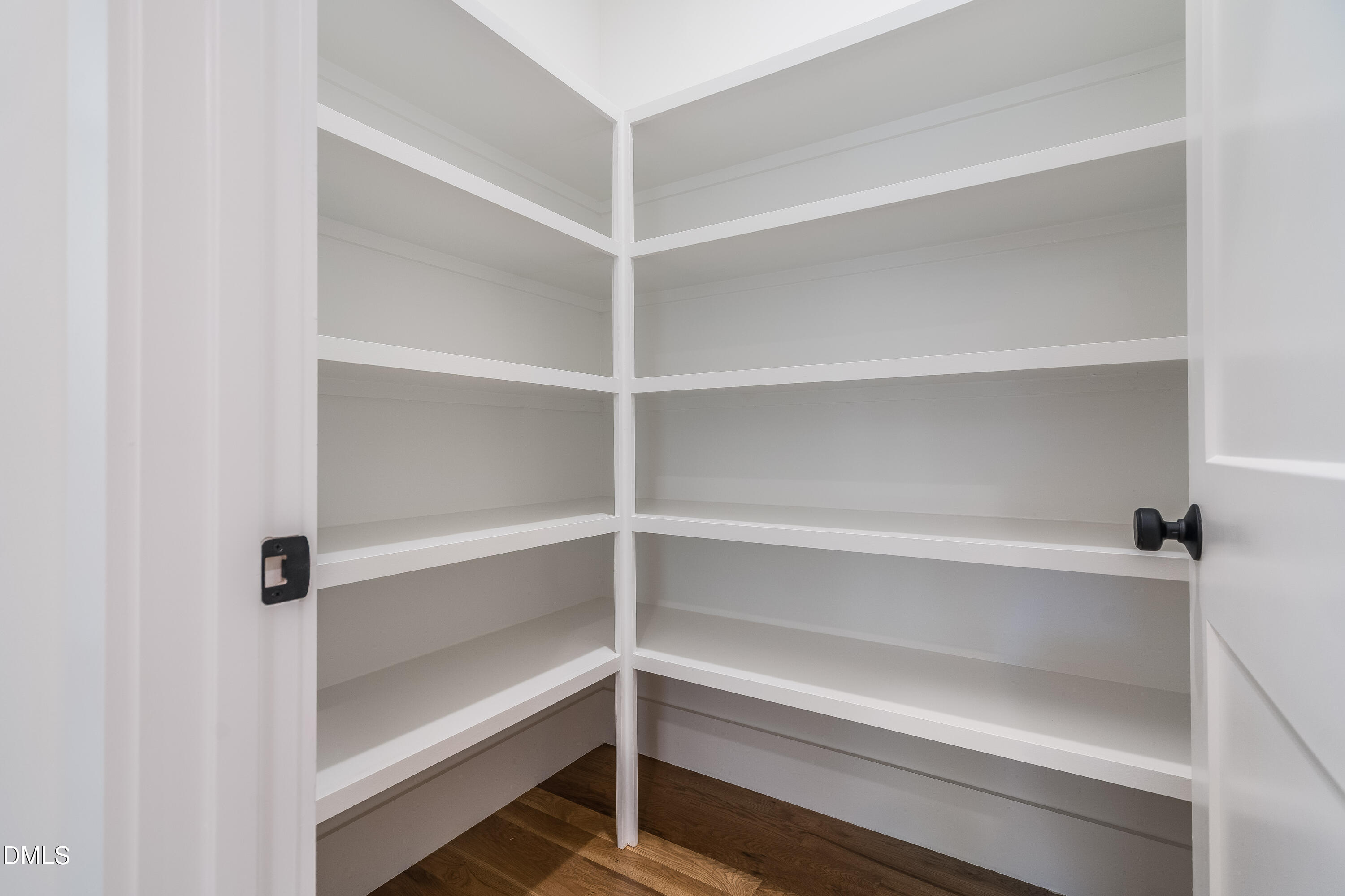 14020 Durant Road Raleigh, NC 27614 - Photo 64 of 86 a view of walk in closet with empty racks