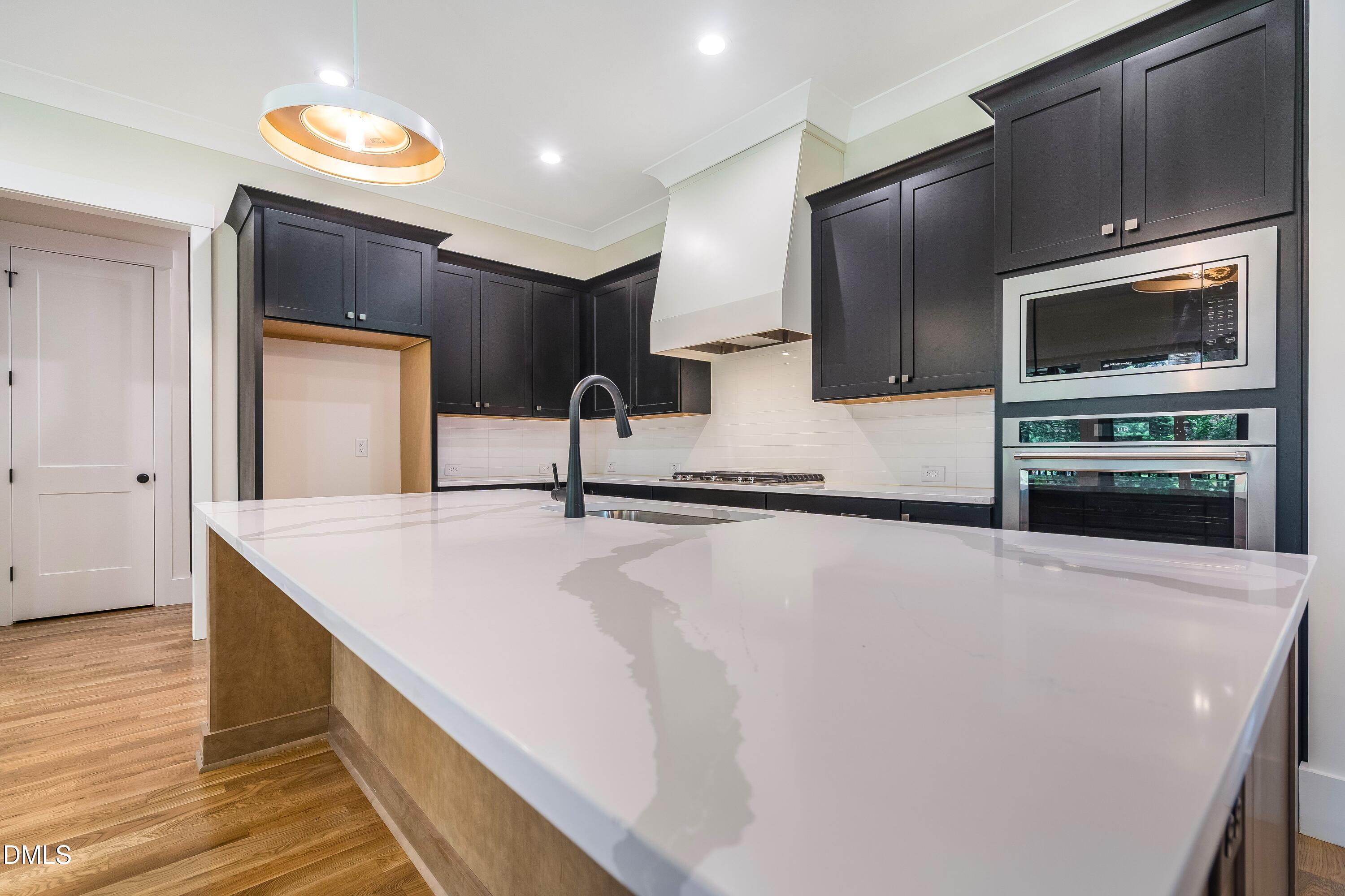 14020 Durant Road Raleigh, NC 27614 - Photo 66 of 86 a kitchen with stainless steel appliances a refrigerator and a stove top oven