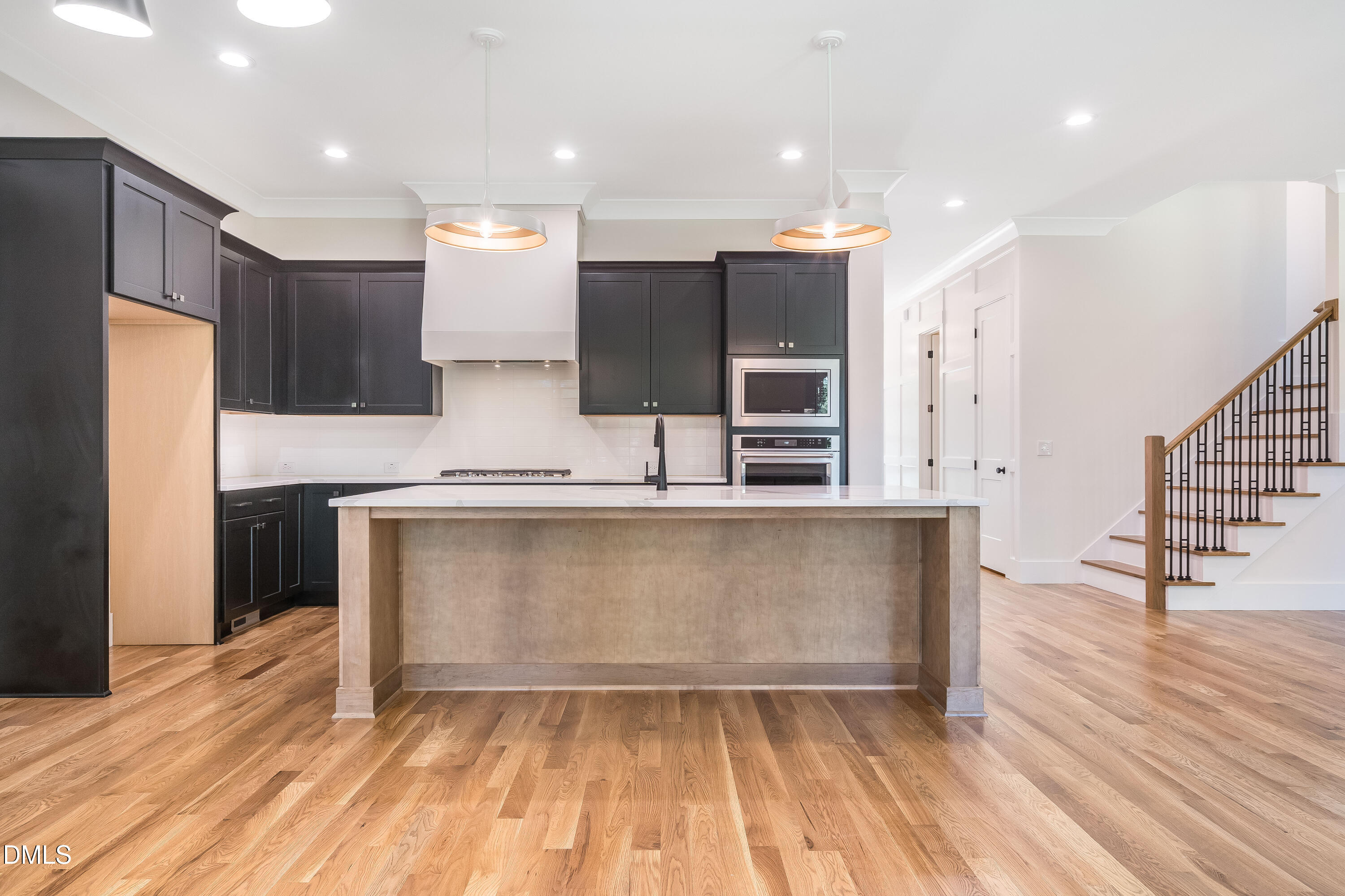 14020 Durant Road Raleigh, NC 27614 - Photo 68 of 86 a large kitchen with stainless steel appliances kitchen island granite countertop a refrigerator and a stove top oven