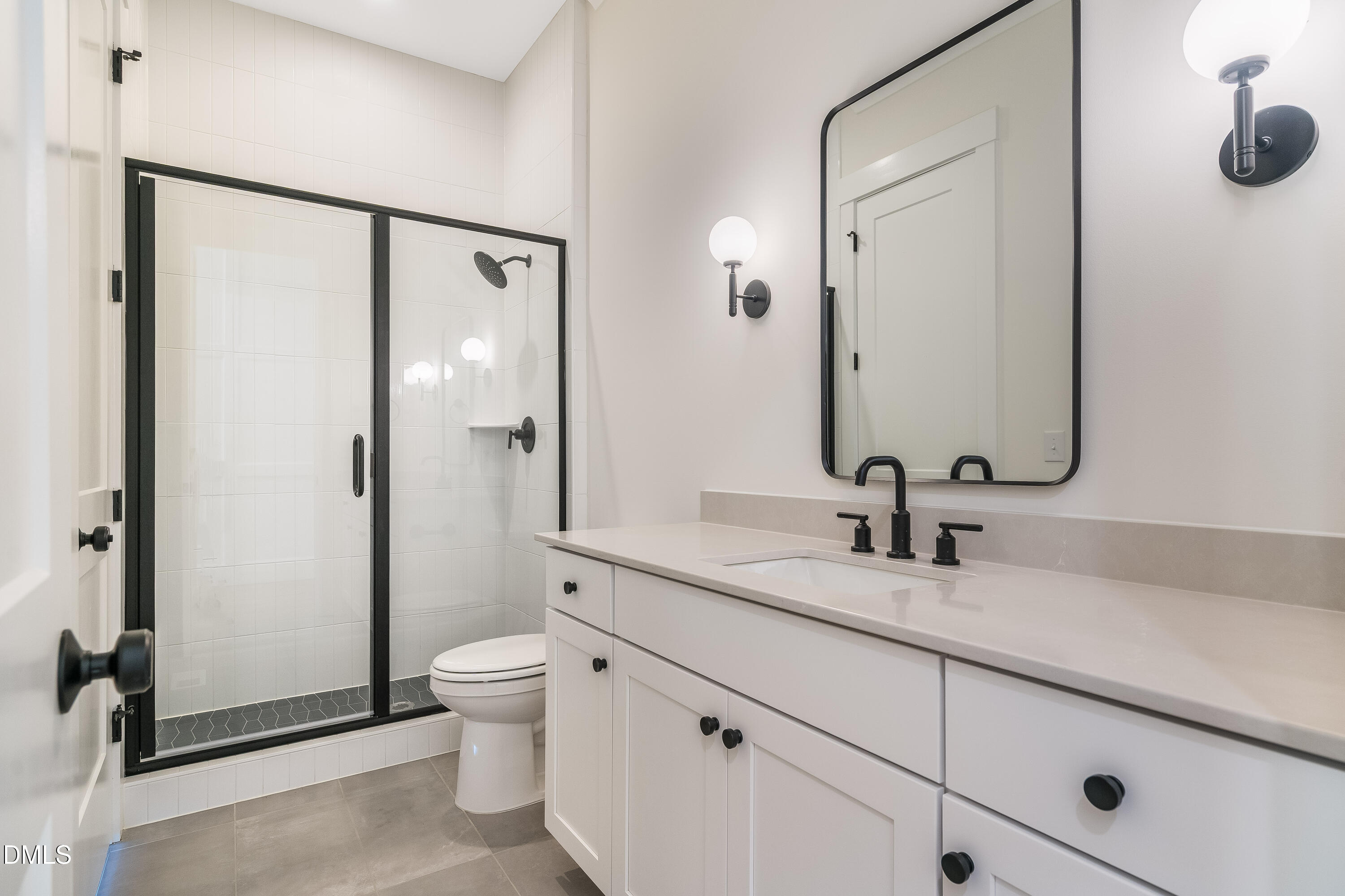 14020 Durant Road Raleigh, NC 27614 - Photo 69 of 86 a bathroom with a granite countertop sink a toilet and a mirror