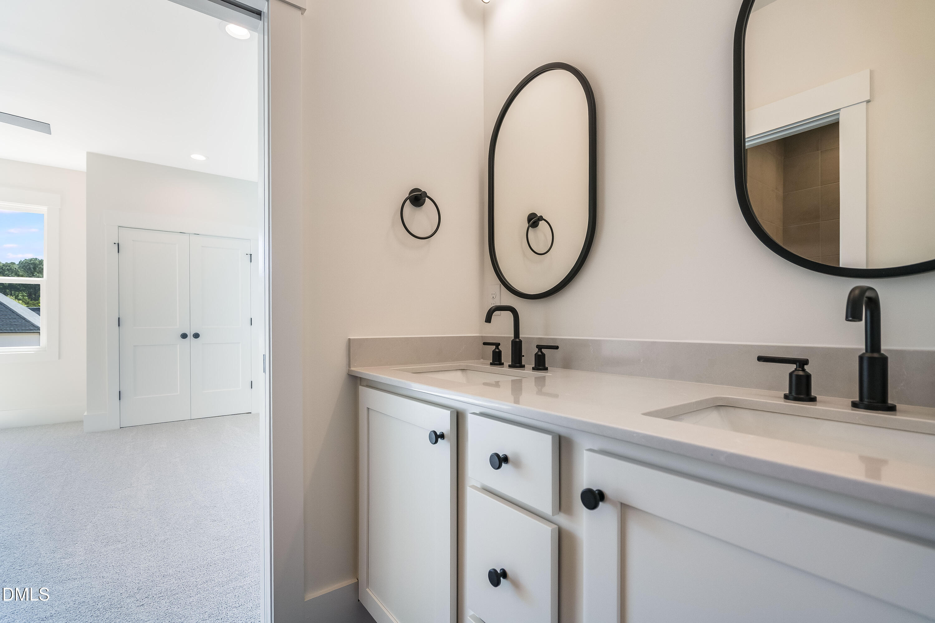 14020 Durant Road Raleigh, NC 27614 - Photo 71 of 86 a bathroom with a sink and a mirror