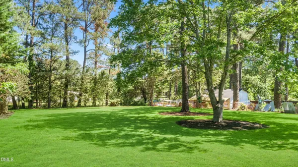 an aerial view of a house with outdoor space and street view