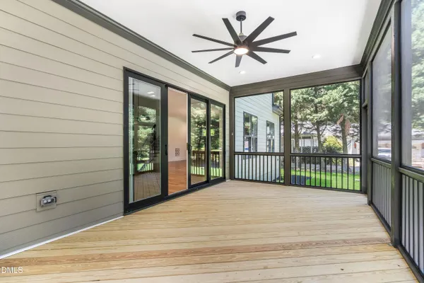 an aerial view of a house with garden space and street view