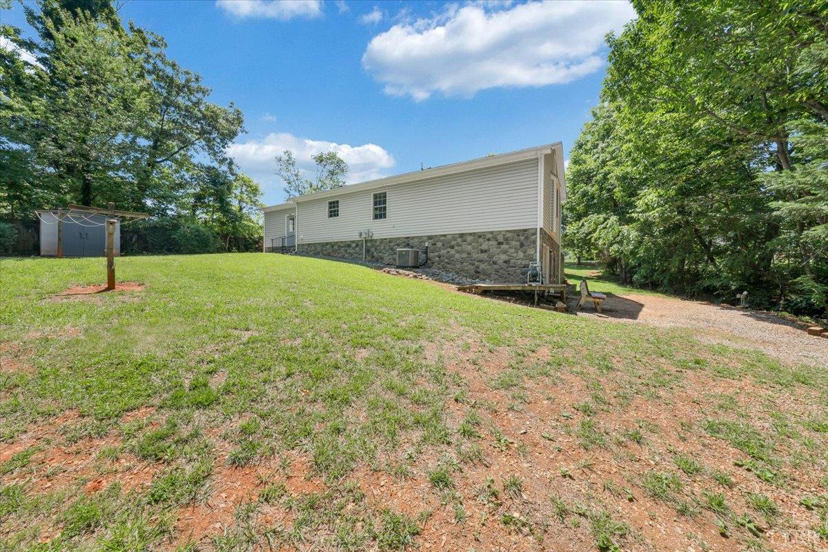 1124 Homeplace Road Bedford, VA 24523 - Photo 37 of 47 a house with green field in front of it