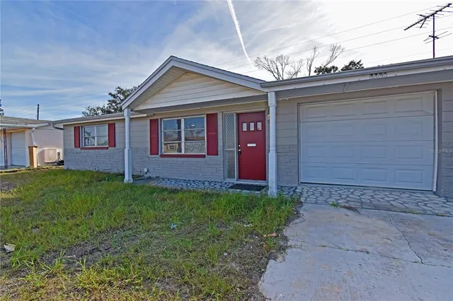 a view of a house with a small yard