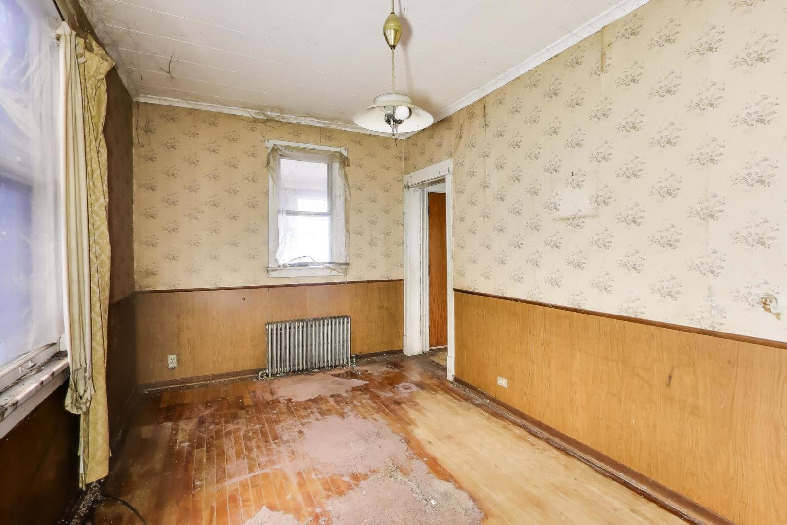 2023 North Kedvale Avenue Chicago, IL 60639 - Photo 3 of 18 a bathroom with a sink and a mirror