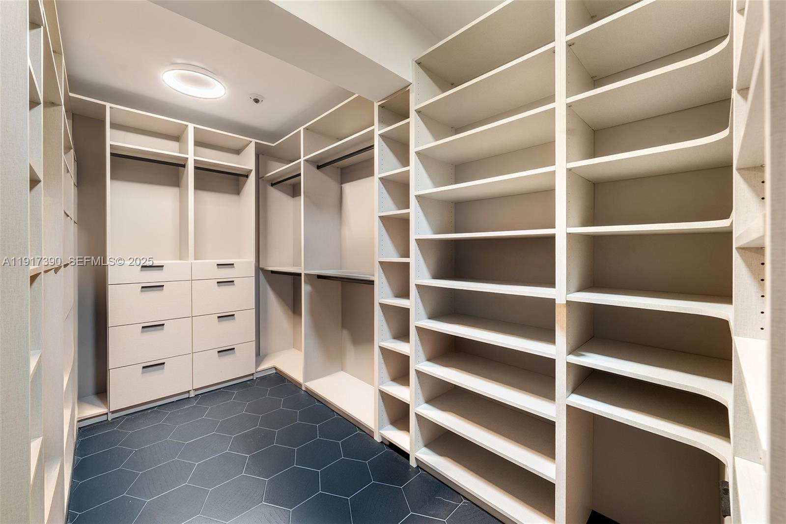 900 Washington Street Hollywood, FL 33019 - Photo 32 of 61 a view of walk in closet with empty racks