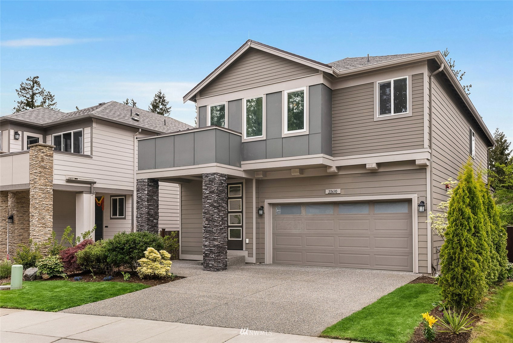 22630 41st Drive Southeast Bothell, WA 98021 - Photo 32 of 35 a front view of a house with a garden and plants