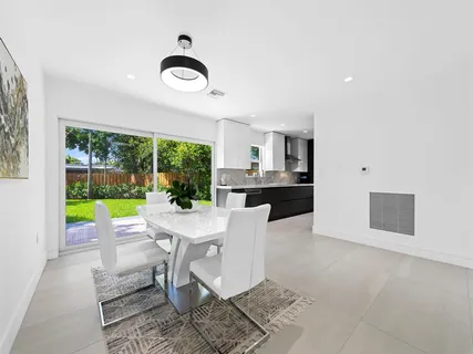 a view of a dining room with furniture window and outside view