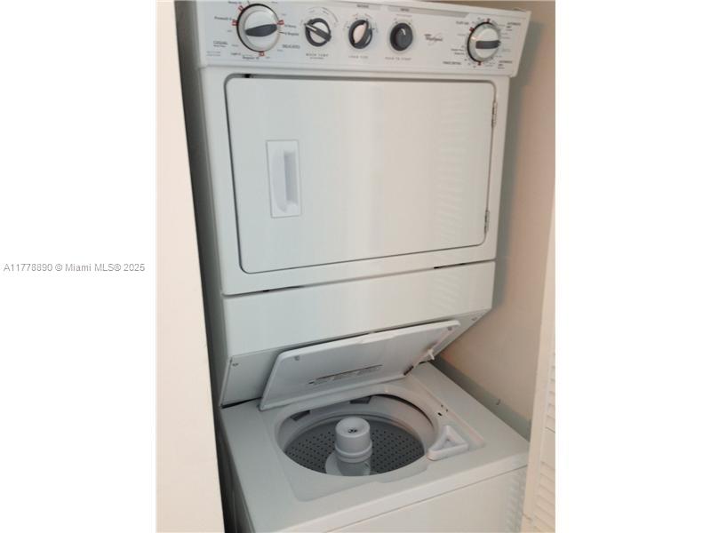 244 Biscayne Boulevard, Unit 250 Miami, FL 33132 - Photo 3 of 8 a utility room with dryer and washer