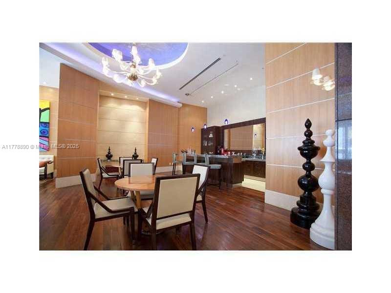 244 Biscayne Boulevard, Unit 250 Miami, FL 33132 - Photo 6 of 8 a living room with furniture and a large window