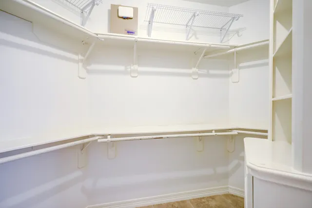 a front view of a house with plants