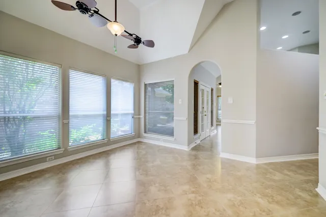 a view of empty room with floor to ceiling windows