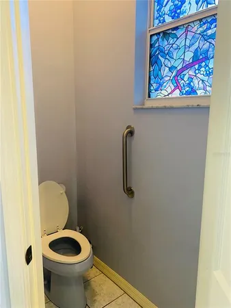 a bathroom with a toilet and a sink