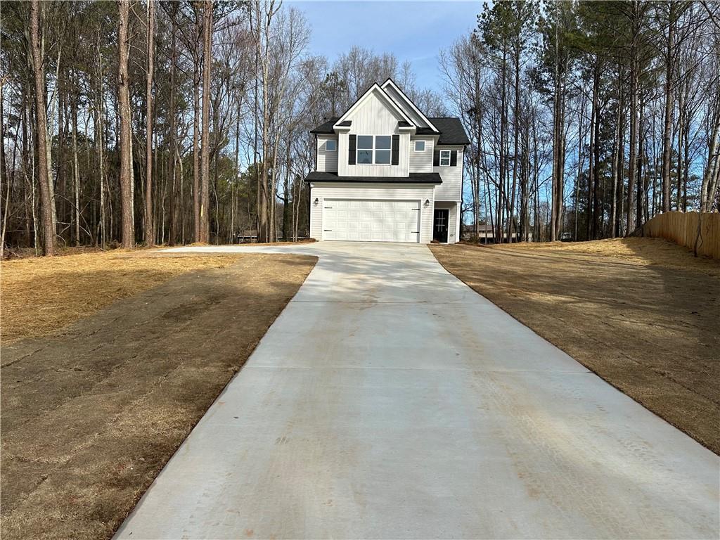 255 Crofton Ridge Bethlehem, GA 30620 - Photo 1 of 1 a front view of a house with a yard and garage