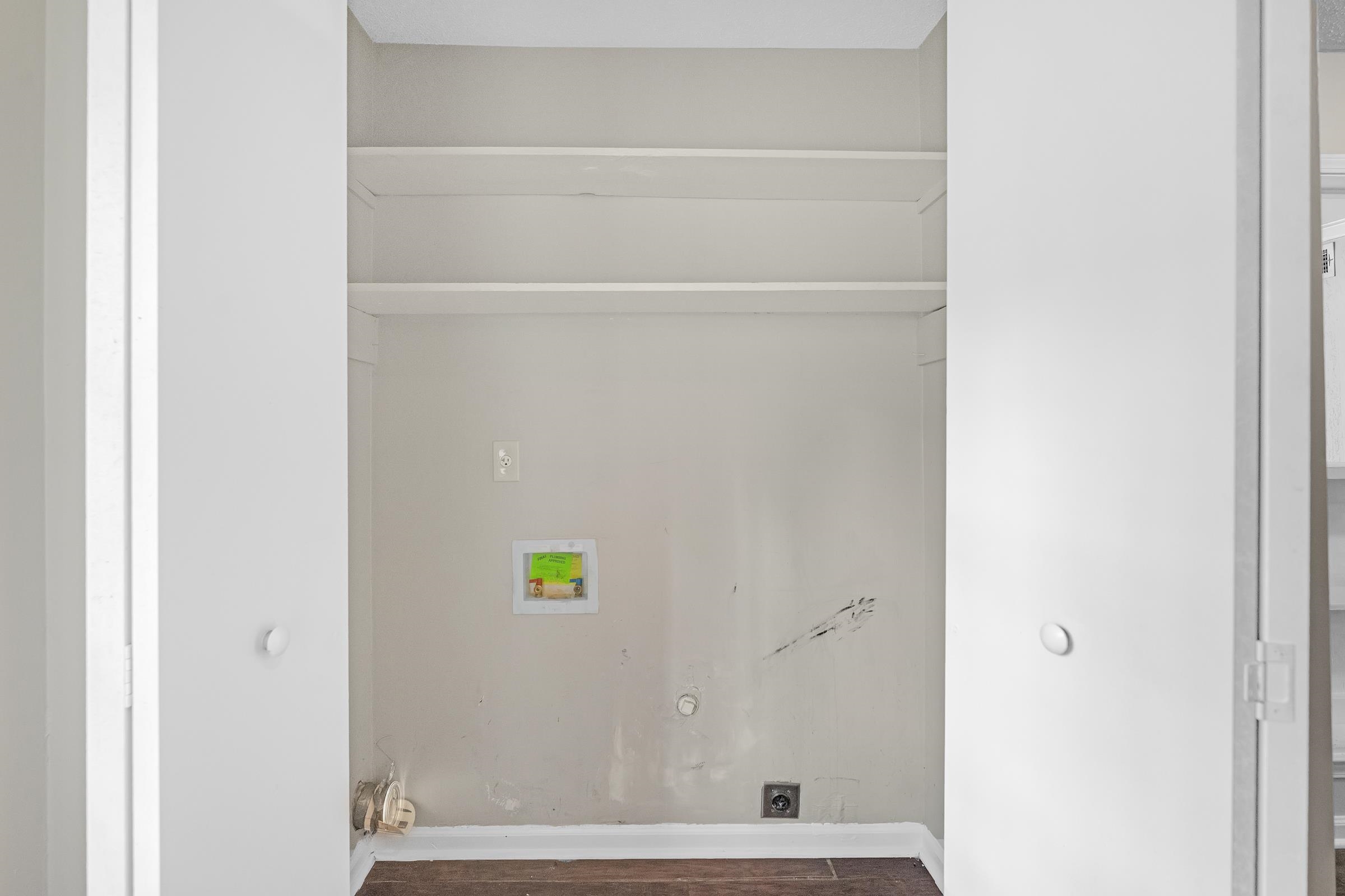 6128 Raintree Drive Memphis, TN 38115 - Photo 11 of 30 Washroom with washer hookup, dark wood-style flooring, and gas dryer hookup