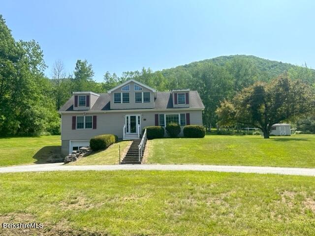 452 Pattison Road North Adams, MA 01247 - Photo 2 of 28 a front view of a house with a yard