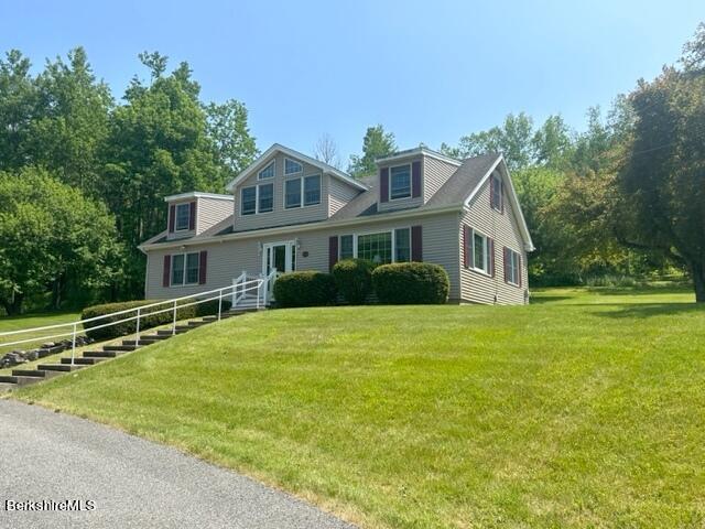 452 Pattison Road North Adams, MA 01247 - Photo 3 of 28 a front view of a house with a garden