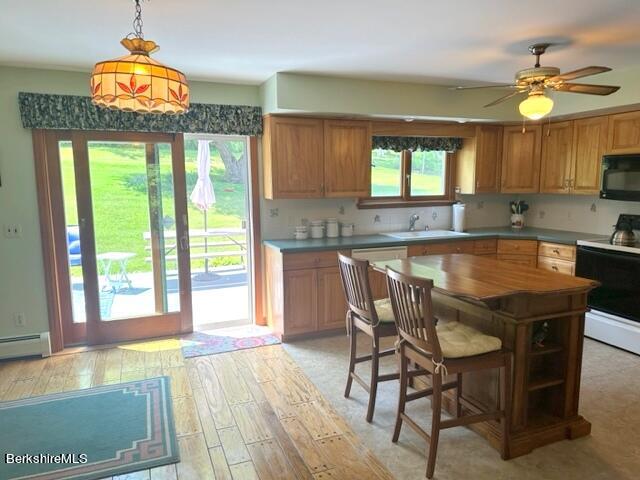452 Pattison Road North Adams, MA 01247 - Photo 5 of 28 a kitchen with a table and chairs in it