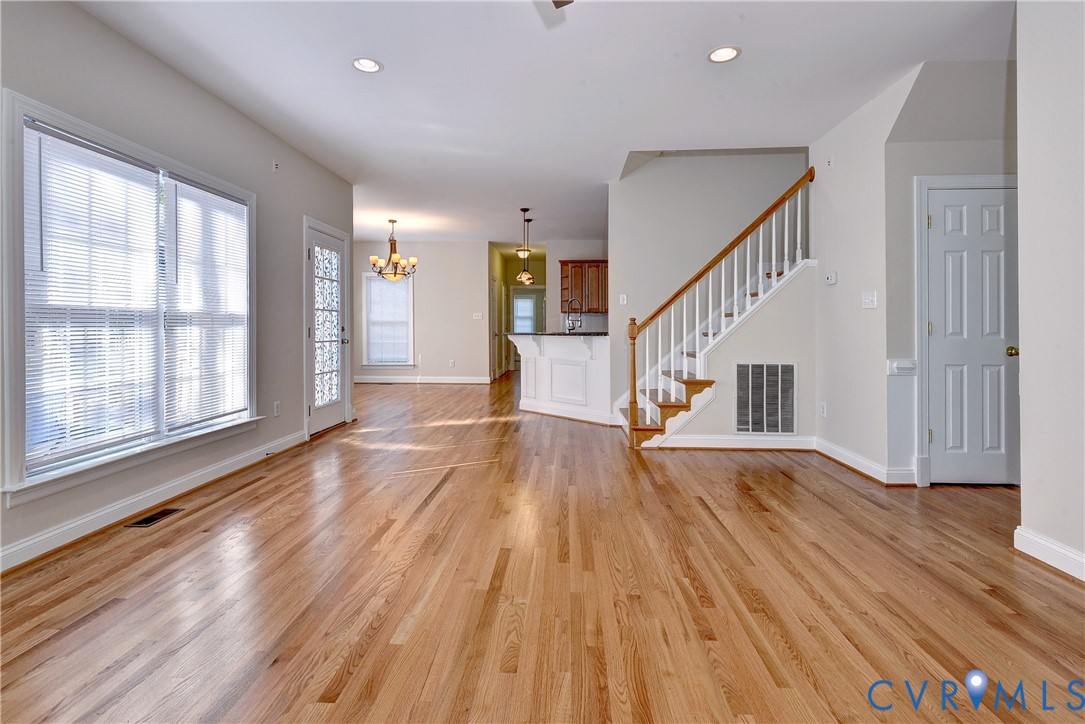11385 Winding River Road Providence Forge, VA 23140 - Photo 8 of 43 a view of empty room with wooden floor and fan