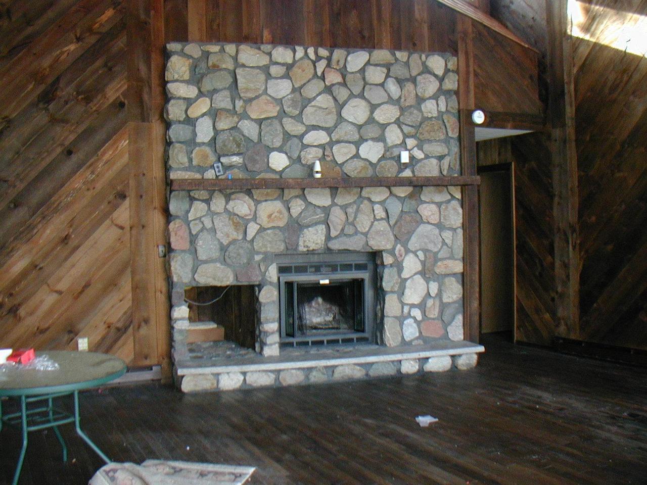 987 Canterbury Road Bushkill, PA 18324 - Photo 3 of 6 a living room with a fireplace