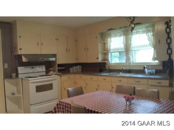 217 Stone Branch Road Staunton, VA 24401 - Photo 15 of 32 a kitchen with a sink cabinets and window