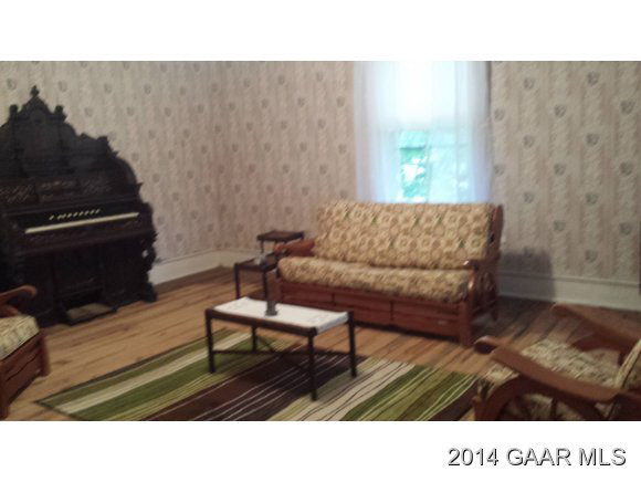 217 Stone Branch Road Staunton, VA 24401 - Photo 21 of 32 a living room with furniture and a fireplace