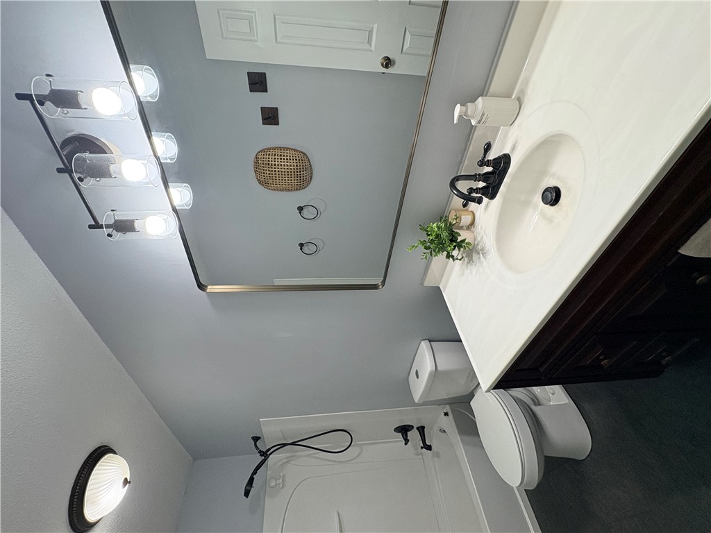 516 Carole Avenue Anderson, SC 29625 - Photo 15 of 34 This bathroom features a contemporary vanity with a sleek sink and stylish fixtures.
