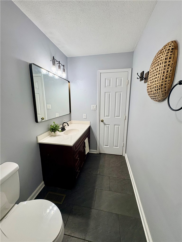 516 Carole Avenue Anderson, SC 29625 - Photo 16 of 34 This sleek bathroom features contemporary fixtures and durable flooring for modern living.