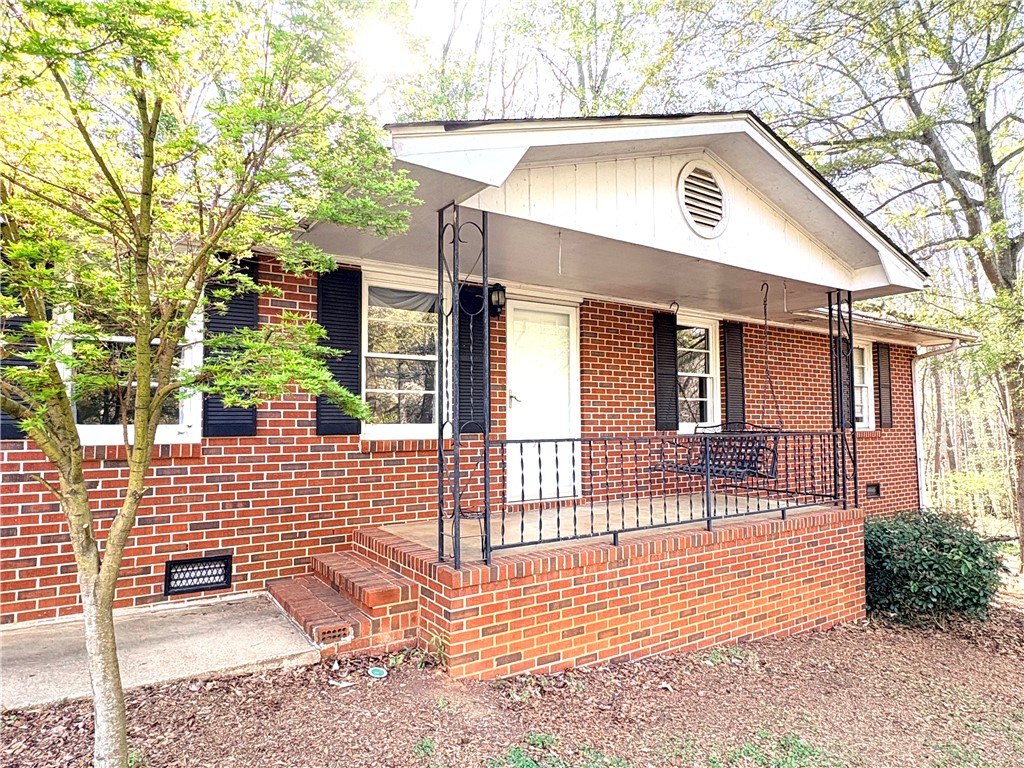 516 Carole Avenue Anderson, SC 29625 - Photo 2 of 34 This charming brick home features a welcoming porch, perfect for enjoying peaceful moments outdoors.