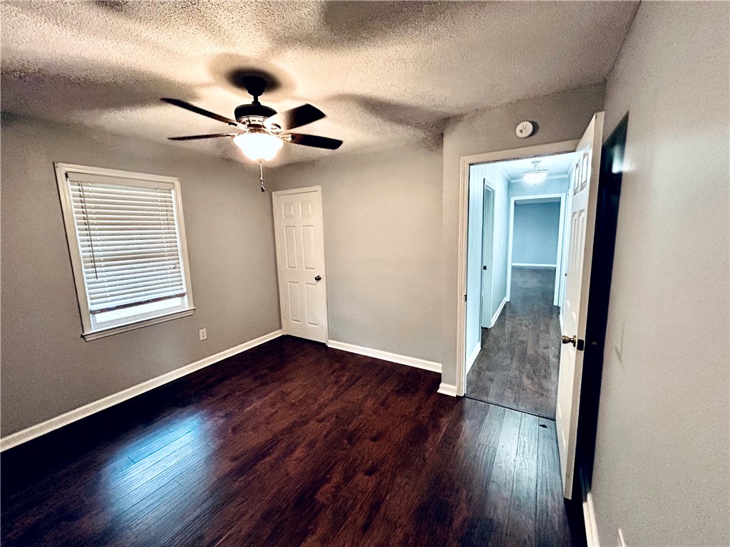 516 Carole Avenue Anderson, SC 29625 - Photo 24 of 34 This inviting bedroom features rich hardwood flooring and a functional ceiling fan for comfort.