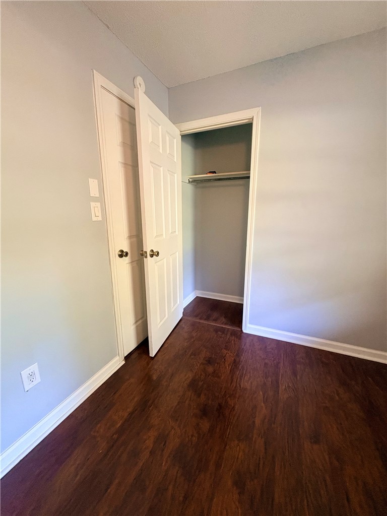 516 Carole Avenue Anderson, SC 29625 - Photo 28 of 34 This cozy bedroom features durable flooring and a convenient closet, ideal for comfortable living.