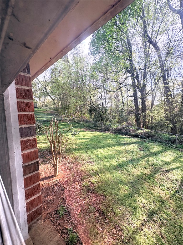 516 Carole Avenue Anderson, SC 29625 - Photo 30 of 34 This lush, green yard offers a private outdoor oasis with ample space for relaxation and activities.