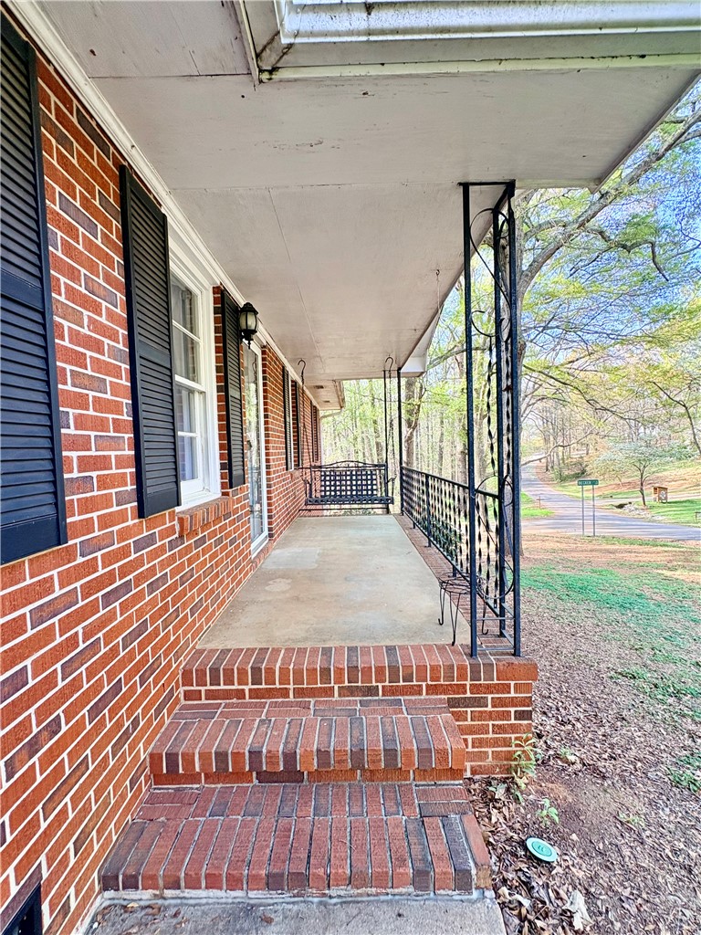 516 Carole Avenue Anderson, SC 29625 - Photo 3 of 34 Welcome to a home featuring a charming front porch, ideal for peaceful outdoor moments.