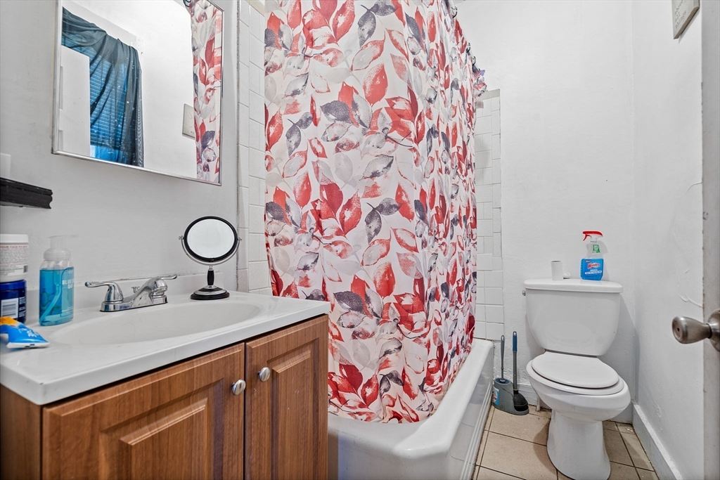 84 Cory Street Fall River, MA 02720 - Photo 16 of 36 a bathroom with a sink and a toilet