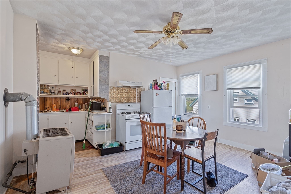 84 Cory Street Fall River, MA 02720 - Photo 17 of 36 a view of a dining room with furniture and a chandelier