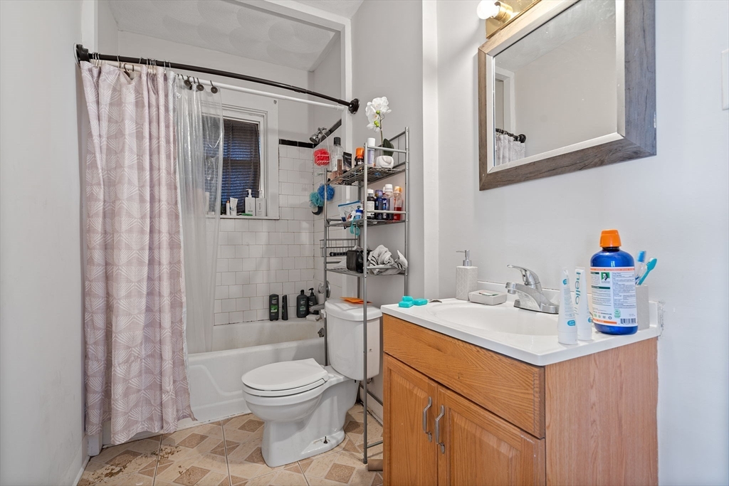 84 Cory Street Fall River, MA 02720 - Photo 21 of 36 a bathroom with a sink toilet and shower