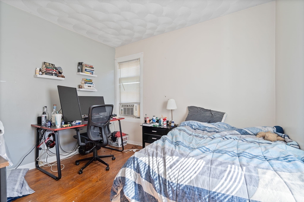 84 Cory Street Fall River, MA 02720 - Photo 22 of 36 a bedroom with a bed and a desk