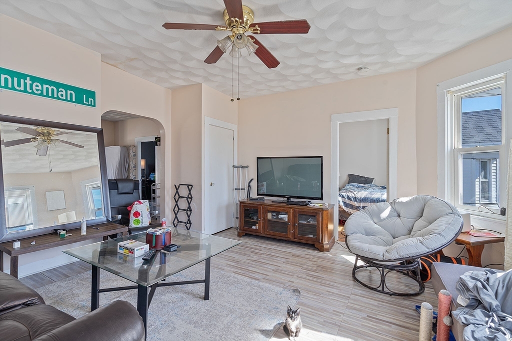 84 Cory Street Fall River, MA 02720 - Photo 23 of 36 a living room with furniture and a flat screen tv