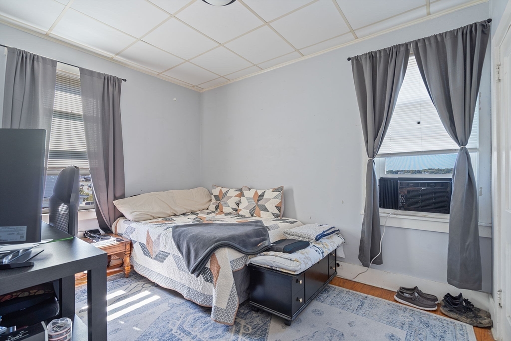 84 Cory Street Fall River, MA 02720 - Photo 27 of 36 a bedroom with a bed and a desk