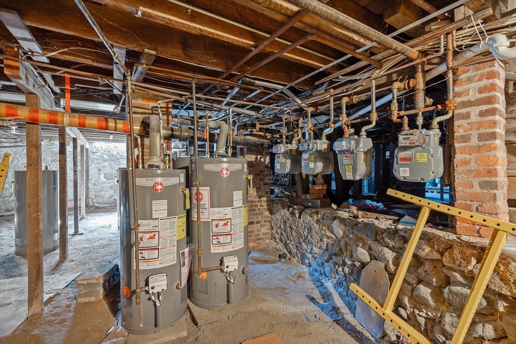 84 Cory Street Fall River, MA 02720 - Photo 31 of 36 a view of a storage room with racks