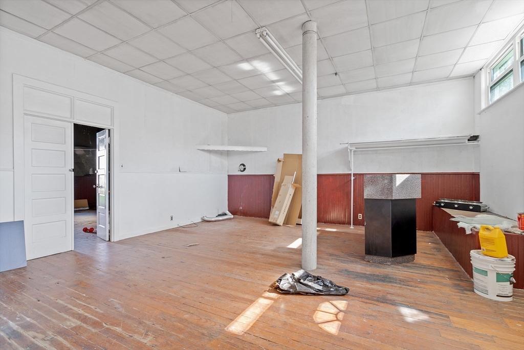 84 Cory Street Fall River, MA 02720 - Photo 33 of 36 a view of a room with wooden floor and furniture