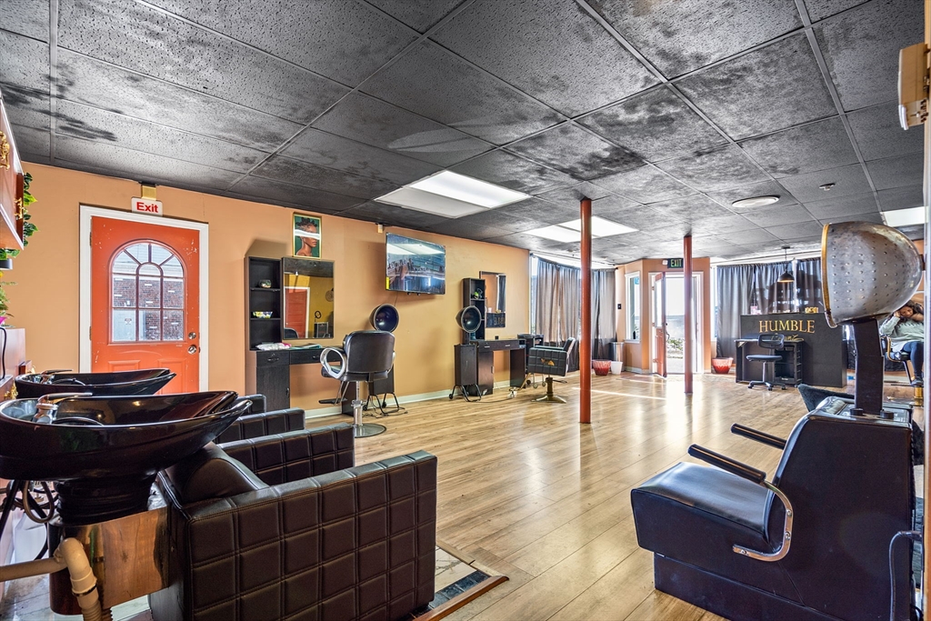 84 Cory Street Fall River, MA 02720 - Photo 8 of 36 a living room with furniture fireplace and a table